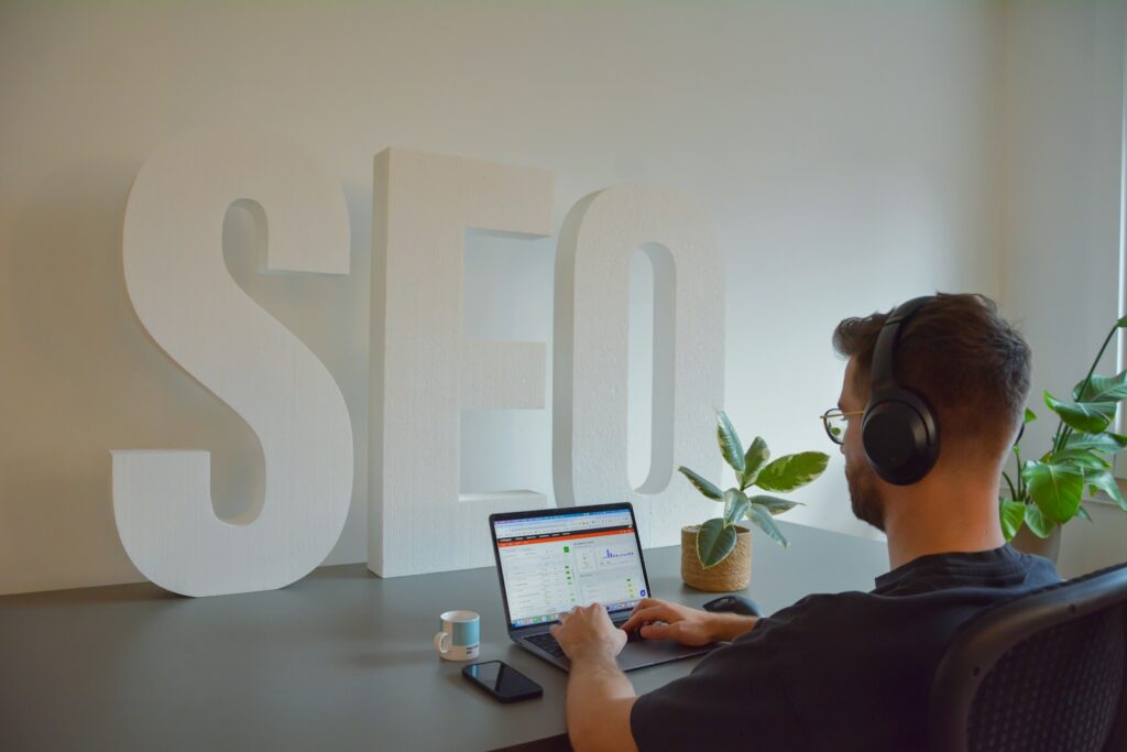 Limo seo marketer sitting in front of a laptop computer